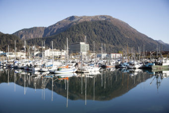 Boats lined up in Harris Harbor on a sunny, clear day Wednesday, Oct. 12, 2016 in downtown Juneau, Alaska. (Photo by Rashah McChesney/Alaska’s Energy Desk)