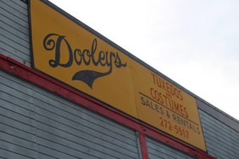Starla Heim, the owner of Dooleys Tuxedos and Costumes. (Photo by Wesley Early, Alaska Public Media – Anchorage)