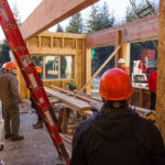 Stakeholders tour the construction of the in-progress Housing First Project on November 17, 2016. (Photo by David Purdy/KTOO)