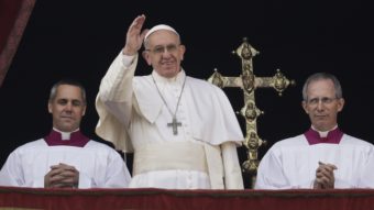 Pope Francis delivered his Christmas day blessing from the main balcony of St. Peter's Basilica at the Vatican Sunday, before a crowd of some 40,000 people. Alessandra Tarantino/AP