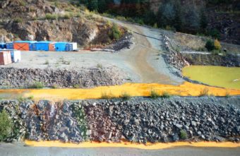 A Tulsequah Chief Mine settling pond overflows at the site about 40 miles northeast of Juneau Sept. 26, 2016. (Photo Courtesy of British Columbia Ministry of Energy and Mines)
