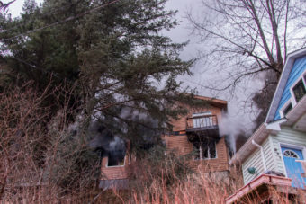 Structure fire on Basin Road continues during the morning of Jan. 31, 2017. (Photo by Mikko Wilson/KTOO)