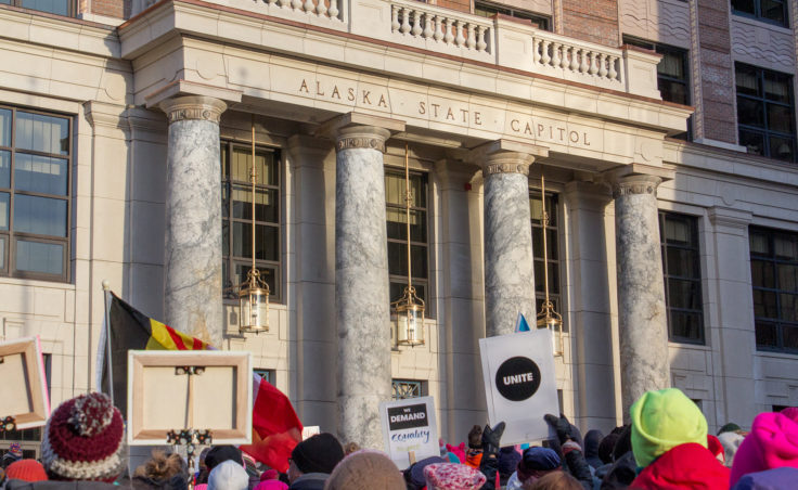 Protesters gather at the Alaska State Capitol for the Women's March on Saturday, Jan. 21, 2017, in Juneau. (Photo by Mikko Wilson/KTOO)