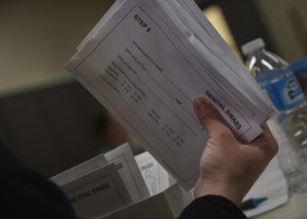 A sailor assigned to the Naval Air Facility Misawa looks at a medical kit used to gain DNA samples after a sexual assault during the victim advocates training at Misawa Air Base, Japan.