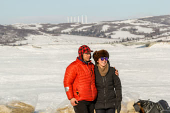 Martin Buser poses with a fan in Unalakleet during the Iditarod. (Photo by Zachariah Hughes/Alaska Public Media)
