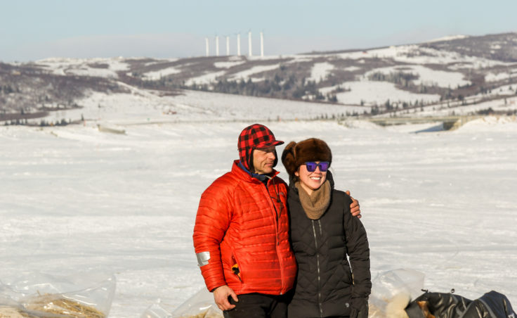 Martin Buser poses with a fan in Unalakleet during the Iditarod. (Photo by Zachariah Hughes/Alaska Public Media)