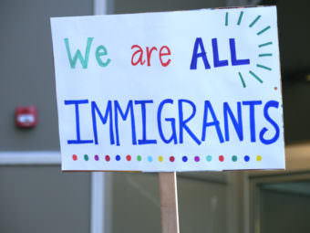 A sign held by Juneau resident Karri Willoughby at a rally at the Alaska state Capitol on Jan. 30, 2017. Protesters rallied against President Donald Trump’s executive order denying immigrants from seven Muslim countries the right of entry into the United States. (Photo by Skip Gray/360 North)