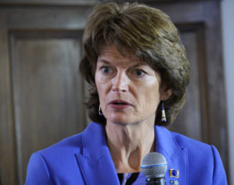 Sen. Lisa Murkowski speaks with reporters at a press availability following her annual address to the Alaska Legislature on Feb. 22, 2017. (Photo by Skip Gray/360 North)