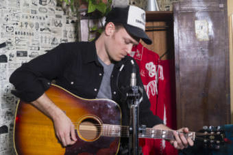 Guitarist Dan Kirkwood performs a Red Carpet Concert at the Alaskan Hotel during the 43rd Annual Alaska Folk Festival. (Photo by Annie Bartholomew/KTOO)