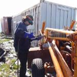 An abandoned backhoe is cut into pieces at the summit of Mount Juneau in 2009. (Photo courtesy of Trail Mix)
