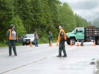 Forest Service employees stand ready to turn visitors away from the Mendenhall Glacier Recreation Center on Sunday, July 2, 2017. (Photo by Quinton Chandler/KTOO)