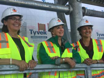 Small Business Administration Alaska District Office Director Nancy Porzio, left, tours Kwethluk school with former wrestling maven and SBA Administrator Linda McMahon and Ana Hoffman. (Photo by Teresa Cotsirilos/KYUK)