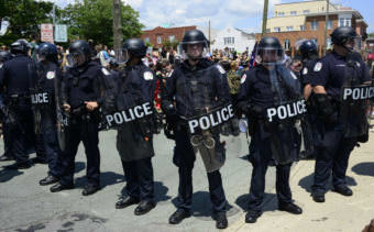 Police form a line near Emancipation Park in Charlottesville, Virginia, amid Unite the Right protesters and counterprotesters on Aug. 12, 2017.