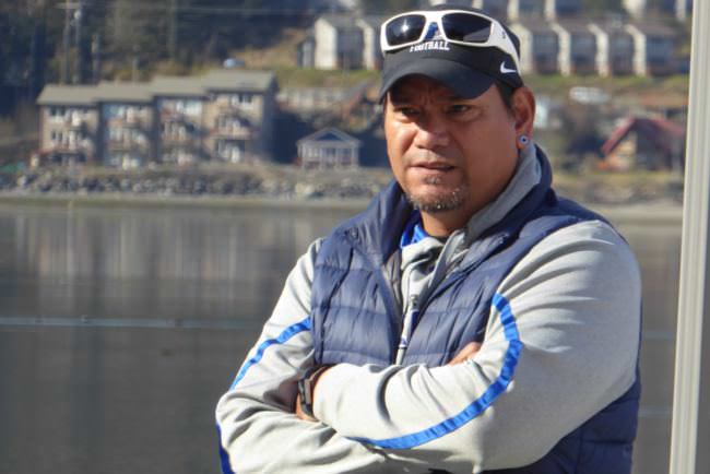 Thunder Mountain High School football coach Randy Quinto oversees his team at the Juneau Maritime Festival on Saturday, May 6, 2017.