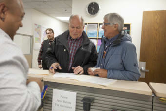 Alaska Gov. Bill Walker and Lt. Gov. Byron Mallott file for re-election on Monday, August 21, 2017, at the Division of Elections in Juneau, Alaska. The two are filing as unaffiliated candidates -- though Mallott maintains his personal affiliation with the Democratic party. (Photo by Rashah McChesney/Alaska's Energy Desk)