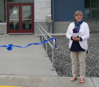 Mayor Cindi Lagoudakis cuts the ribbon July 4, 2017, on the renovated municipal building. (KFSK file photo)