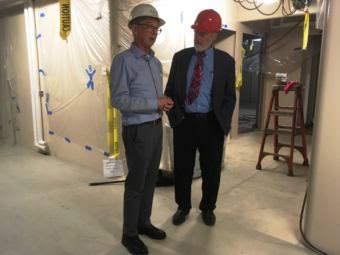 Vigor Alaska Shipyard Development director Doug Ward talks with Marine Transportation advisory board member Greg Wakefield inside the not-quite-finished Alaska Class ferry Tazlina. (Photo by Leila Kheiry/KRBD)