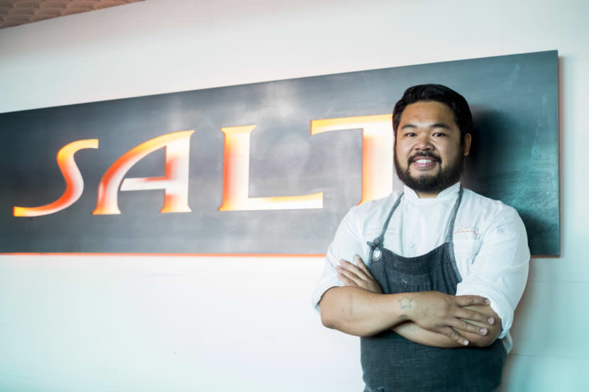 Chef Lionel Uddipa stands inside the downtown restaurant Salt in Juneau on August 10, 2017. His winning dish of Bristol Bay king crab with risotto took first place at the Great American Seafood Cook-Off  in New Orleans. (Photo by Annie Bartholomew/KTOO)