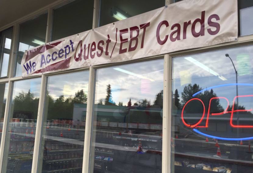 A sign outside of a store in midtown Anchorage announcing that they accept EBT Cards, the distribution method for SNAP benefits. (Photo by Hillman/Alaska Public Media)