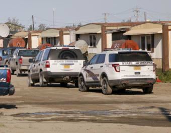 Alaska Troopers search homes and cabs in Bethel's Trailer Court, on June 7, 2016, looking for evidence of illegal alcohol sales. (Photo by Dean Swope/KYUK)