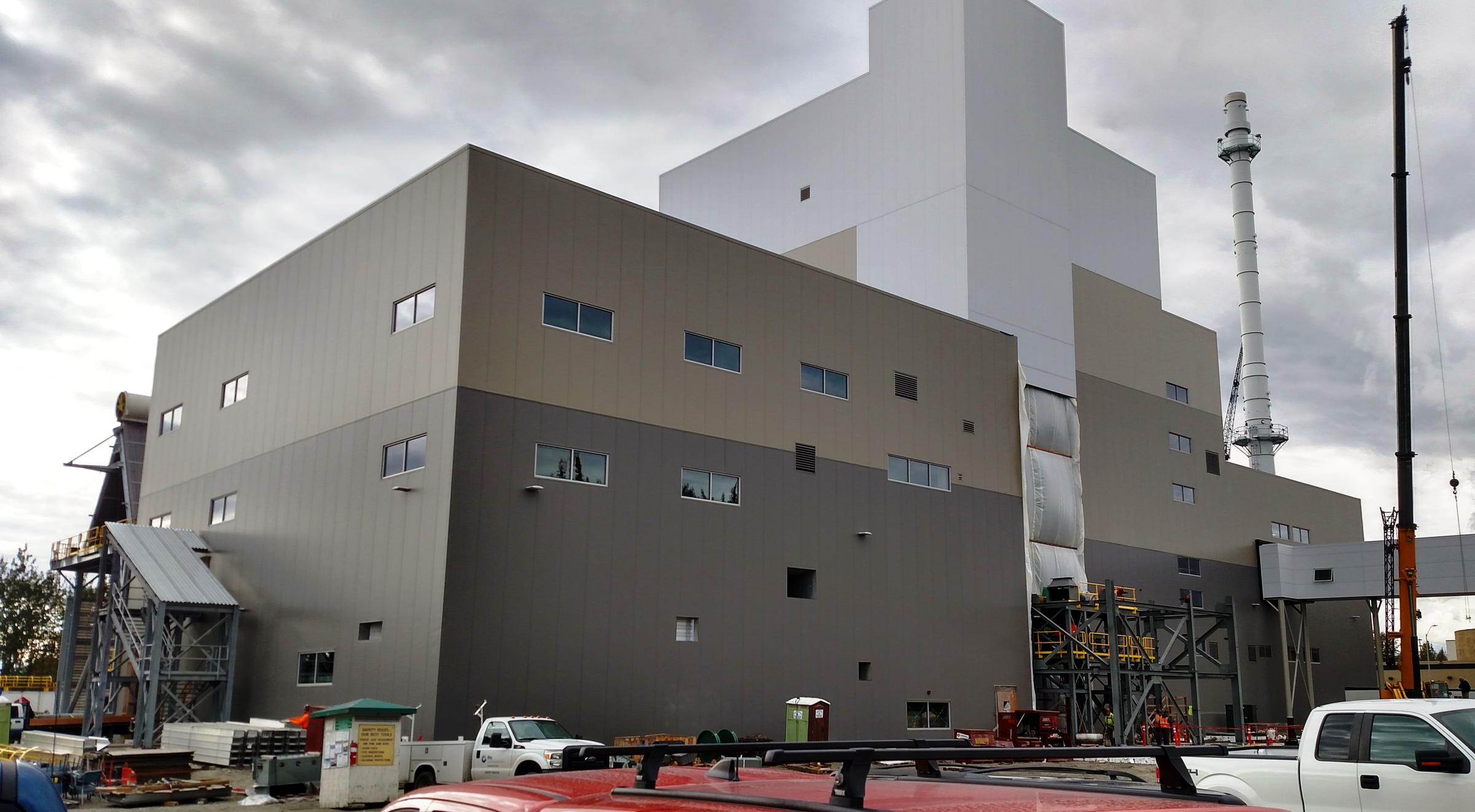Work on University of Alaska Fairbanks' new 17-megawatt combined heat and power plant is about half done. University officials say it’s scheduled to go online in December 2018. (Photo by Tim Ellis/KUAC)
