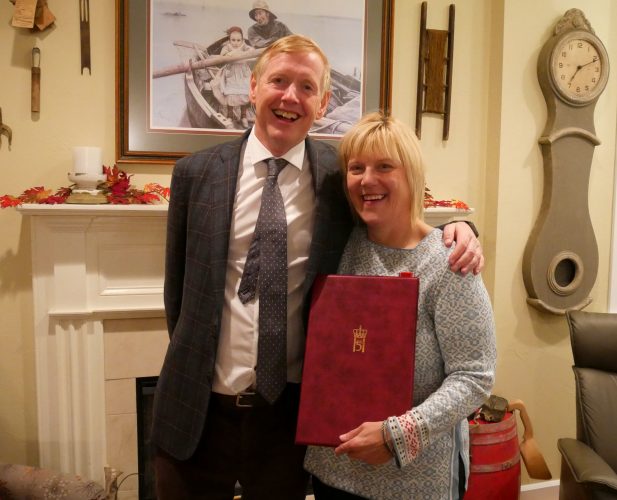 Ambassador of Norway to the United States, Kare Aas, and Glo Wollen pose for a photo Sept. 28, 2017, after she was award the Medal of St. Olav. (Photo by Angela Denning/KFSK)
