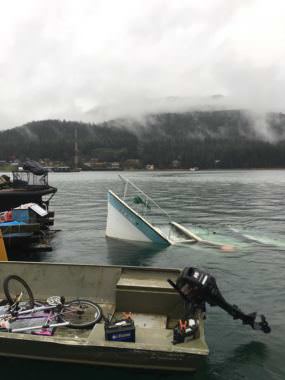 The bow of a partially-submerged vessel pokes out of Gastineau Channel on Saturday, Oct. 21, 2017.