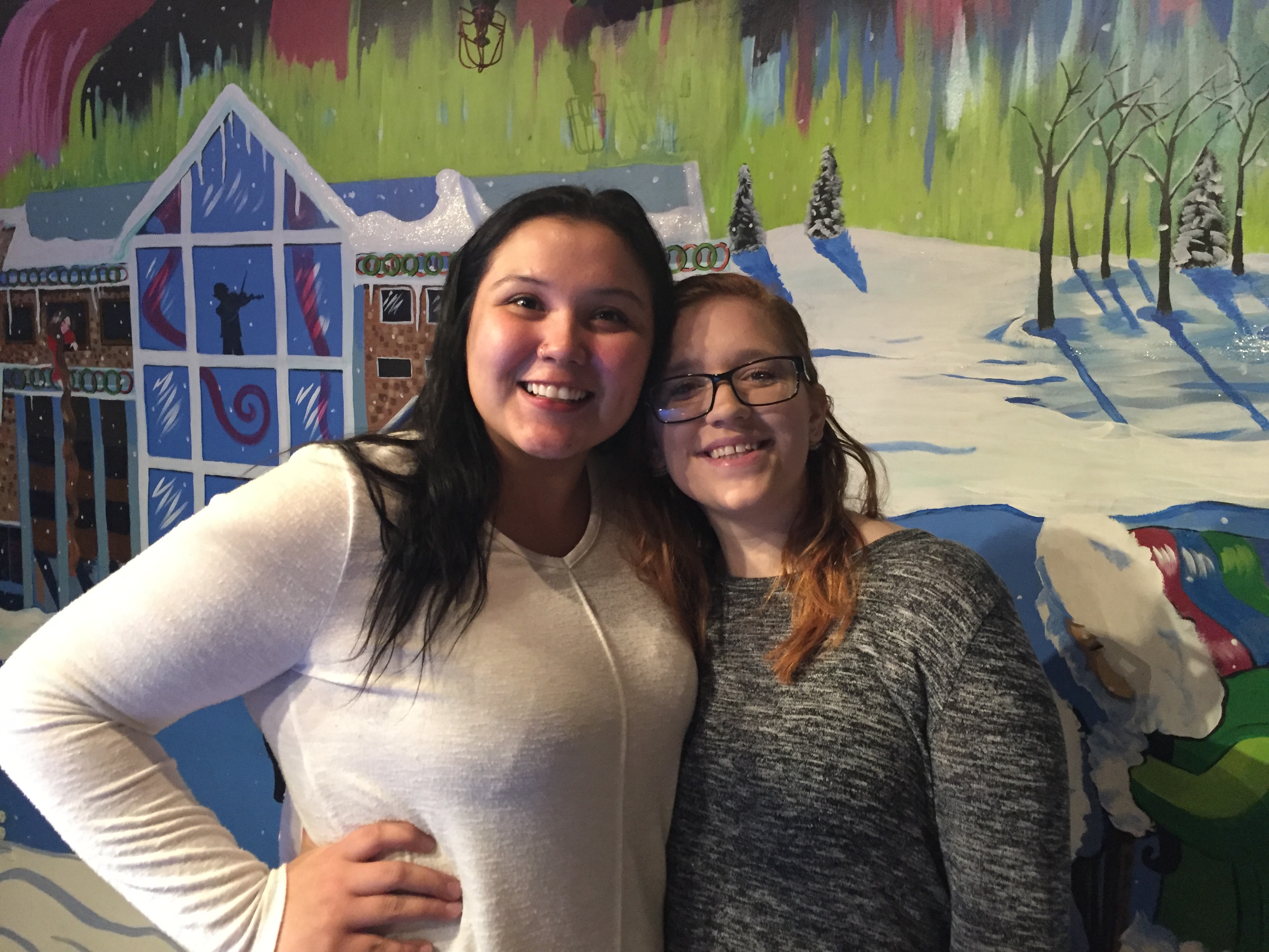 Natilia Edwards, left, and Anna Redmon gather for breakfast. (Photo by Anne Hillman/Alaska Public Media)