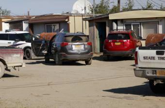 Alaska Troopers search homes and cabs in Bethel's Trailer Court, on June 7, 2016, looking for evidence of illegal alcohol sales. (Photo by KYUK)