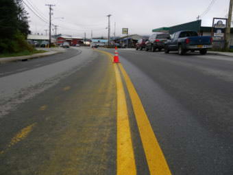 Cones cover slow-drying yellow lines on South Nordic Drive in Petersburg on Thursday, October 12, 2017. (Photo by Joe Viechnicki/KFSK)