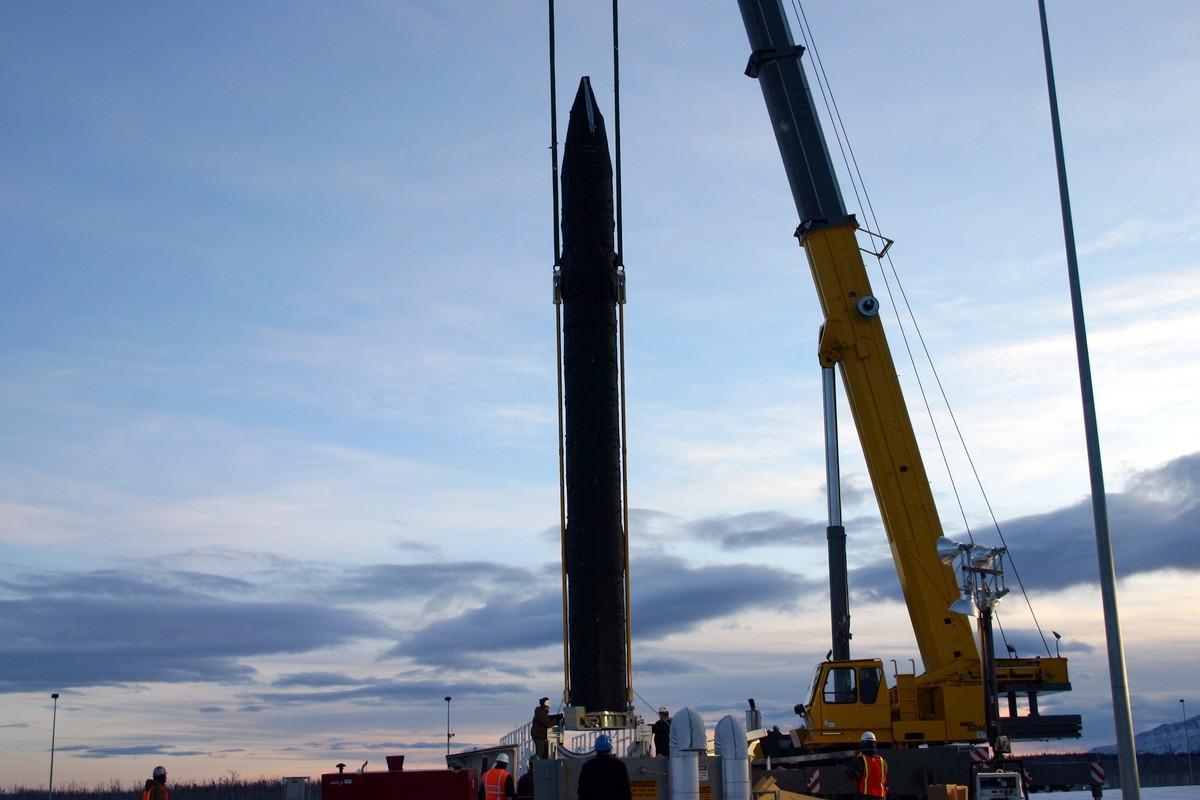 One of 40 ground-base interceptor missiles at Greely’s missile-defense base is lowered into its silo. (Photo courtesy Missile Defense Agency)