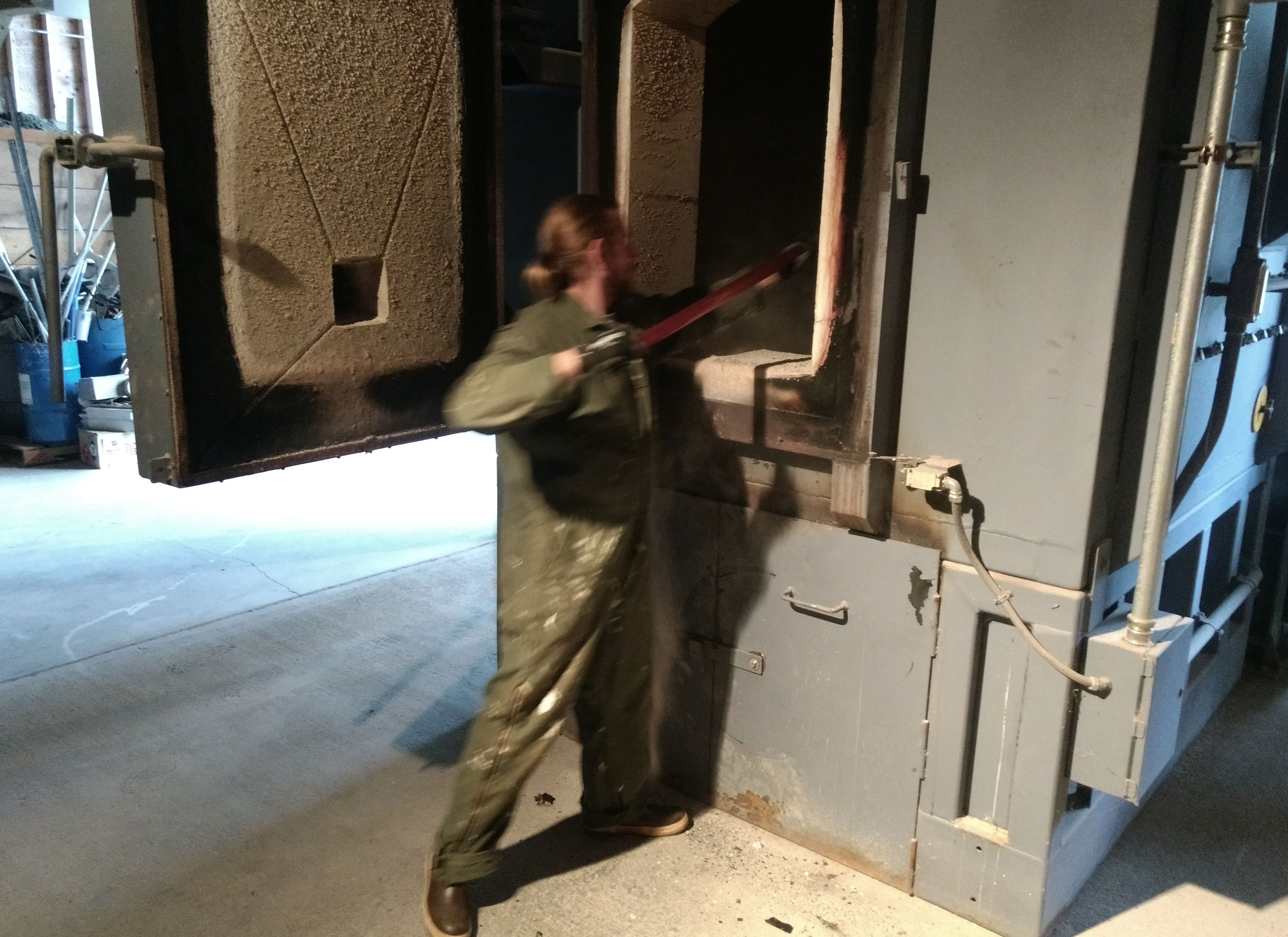 National Park Service maintenance worker Dan Grivois loads the park’s waste incinerator on Sept. 5. (Photo by Jacob Resneck/KTOO)