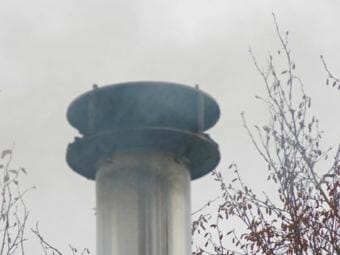Wood stove pipe on a Fairbanks home. (Photo by Dan Bross/KUAC)