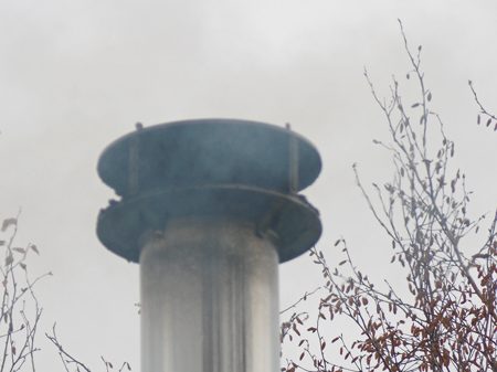 Wood stove pipe on a Fairbanks home. (Photo by Dan Bross/KUAC)