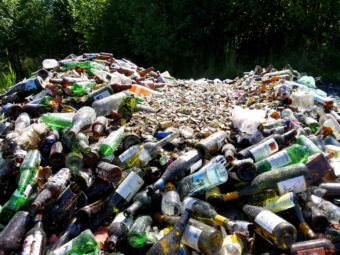 A pile of glass at the Petersburg landfill gets crushed and used in layers to build a road. (Photo by Angela Denning/KFSK)