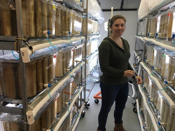 Tamsen Peeples stands in the room where Blue Evolution keeps its tanks full of seeded string, which will eventually grow into seaweed. (Photo by Kayla Desroches/KMXT)