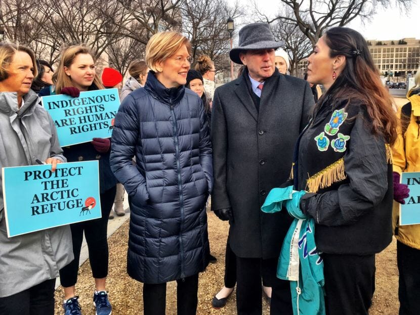 Gwich’in leader Bernadette Demientieff, speaks to Sens. Elizabeth Warren, D-Massachusetts, and Tom Udall, D-New Mexico, at an anti-drilling rally in Washington, D.C., on Dec. 6, 2017.
