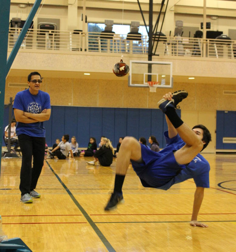 Thunder Mountain High School senior Josh Sheakley attempts the Alaskan High Kick at a community event at UAS. (Photo by Adelyn Baxter/KTOO)