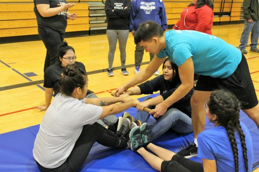 Athletes compete in the Eskimo Stick Pull. (Photo by Adelyn Baxter/KTOO)