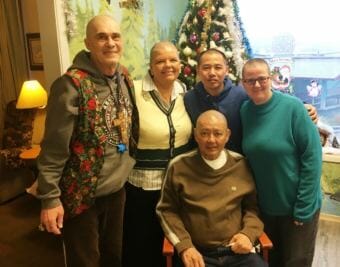 Don Harrington, left, Licha Kelley-King, Phong Nguyen, Kessinger and Virgil Panchle, seated, shaved their heads in support of Bobbi Kessinger. (Photo by Leila Kheiry/KRBD)