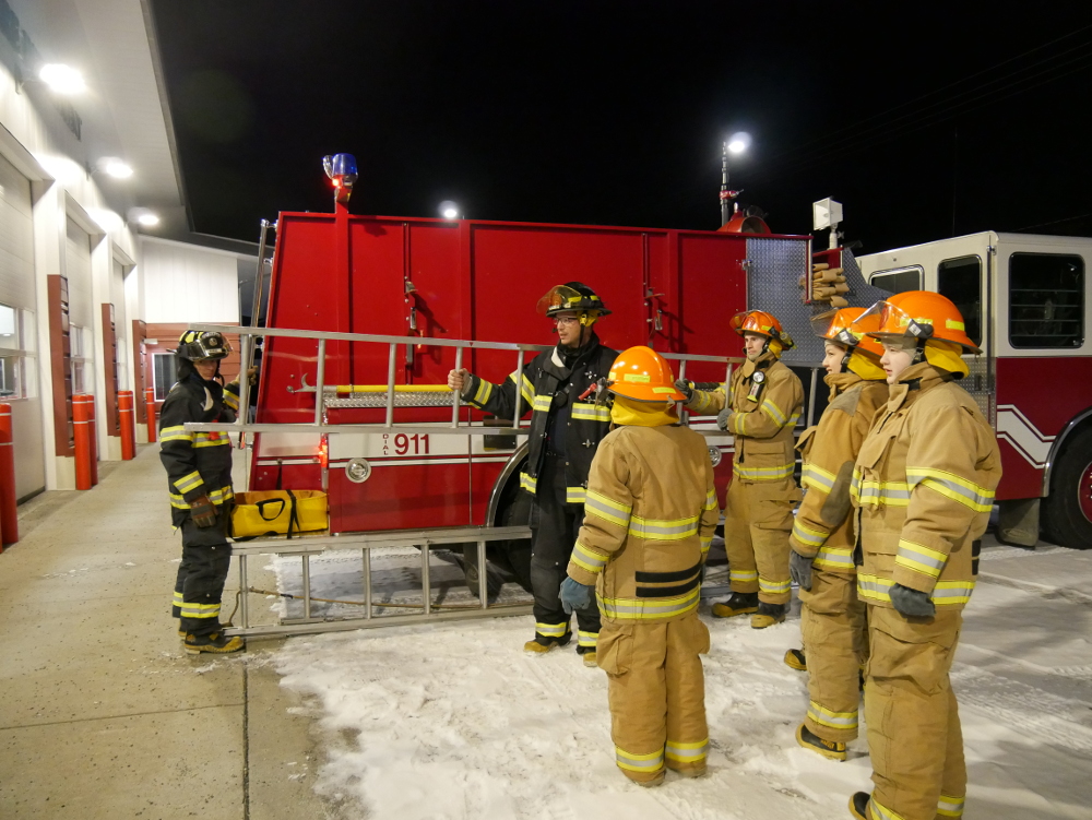 Petersburg Volunteer Fire Department volunteers Rchard Burke and Alan Malone train five local teens November 20, 2017, in use of ladders at Petersburg’s fire hall. (Photo by Joe Viechnicki/KFSK)