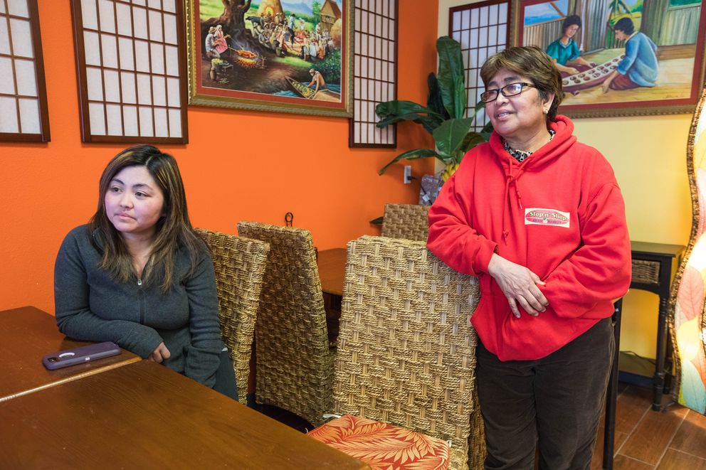 Betalyn Delacruz, owner of the Stop N’ Shop Asian Market, and her mom, Marietta Morota, speak about the impact of volcano Mayon’s eruption on their family that live near the mountain in the Philippines, on Wednesday. (Photo by Loren Holmes/Anchorage Daily News)