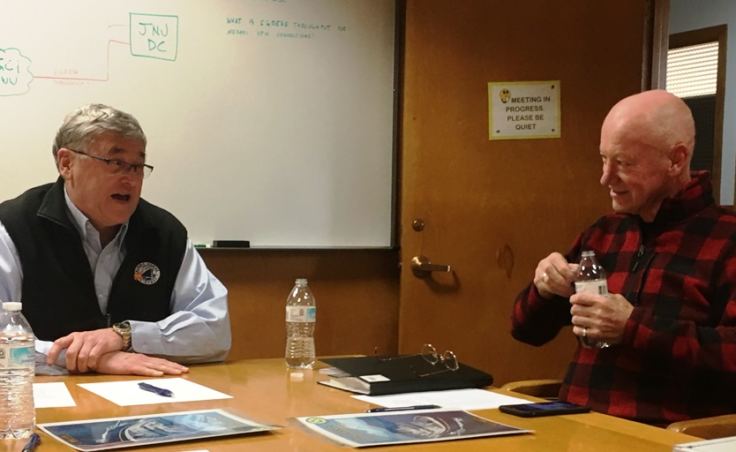 AMHS General Manager Capt. John Favley talks to the Taku’s new owner Ben Evans during a signing ceremony to finalize the sale of the state’s 55-year old ferry om Ketchikan on Jan. 19, 2018.