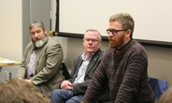 Rep. Justin Parish addresses a packed room at the Mendenhall Valley Public Library during a town hall with Juneau's state legislators on Thursday, Jan. 11, 2018. Parish, Rep. Sam Kito III, left, and Sen. Dennis Egan make up Juneau's legislative delegation. (Photo by Adelyn Baxter/KTOO)