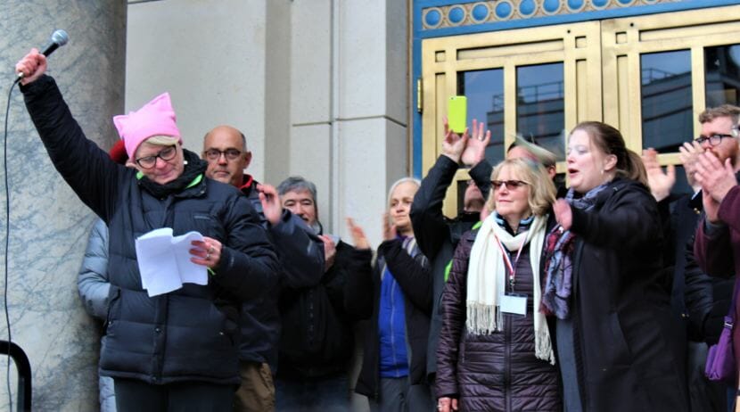 Former Juneau Rep. Beth Kerttula stands with other lawmakers on the steps of the Alaska State Capitol on Jan. 20, 2018.