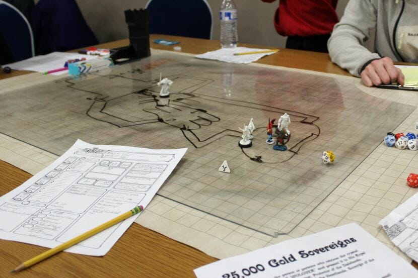 Character miniatures and dice sit on a Dungeons & Dragons grid at Platypus Con on Jan. 28, 2018. (Photo by Adelyn Baxter/KTOO)