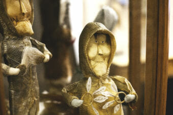 Yupik dolls with fish skin jackets are on display at Aunt Claudia's Dolls museum in downtown Juneau. (Photo by Tripp J Crouse/KTOO)