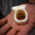 An Ivory ring carved and signed by King Island carver John I. Kokuluk. (Photo by Emily Russell/KNOM)