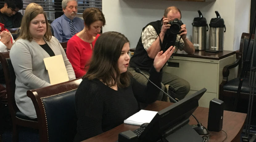 Stella Tallmon, a sophomore at Juneau-Douglas High School, testifies before the Alaska House Judiciary Committee, Feb. 28, 2018. Rep. Geran Tarr, D-Anchorage, is on the left. Tarr sponsored a bill allowing judges to issue protective orders removing guns from people judged to likely be a threat to themselves or others. (Photo by Andrew Kitchenman/KTOO)