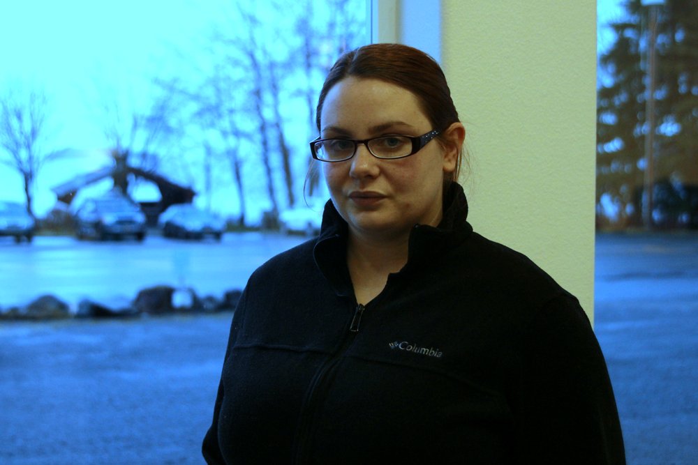 Indea Ford in Sitka this past January, the day before she flew to Anchorage and surrendered to US Marshals. She had been under house arrest in Sitka since April 2017, when the US Department of State received an extradition petition from the UK. A year away from full citizenship, Ford had just taken her driver’s license exam and was celebrating with lunch at the Westmark with her husband and three children, when Sitka police arrested her on the street corner. “I thought I had failed the test!” she says. (Photo by Robert Woolsey/ KCAW)